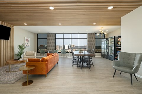 A modern living room with a large window overlooking the city.