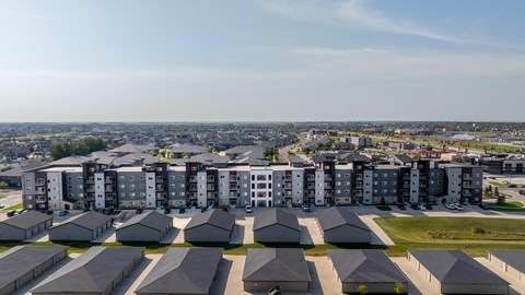 A large housing complex with multiple buildings and attached houses.