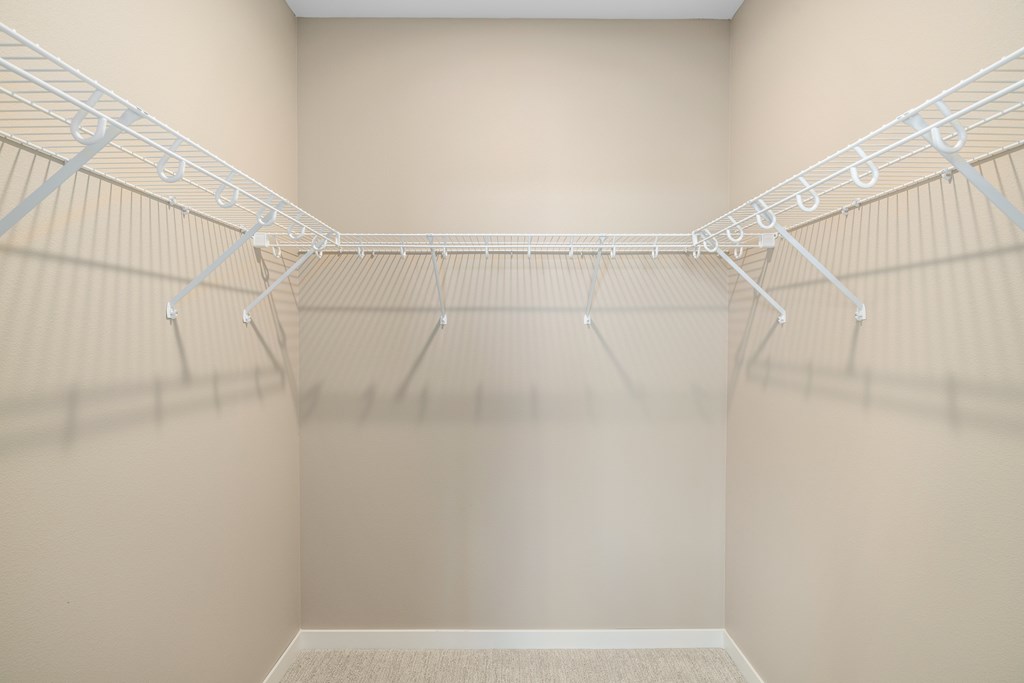 Empty white shelves in a room.