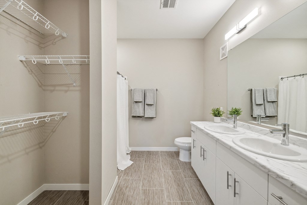 a bathroom with a sink and a shower and a toilet