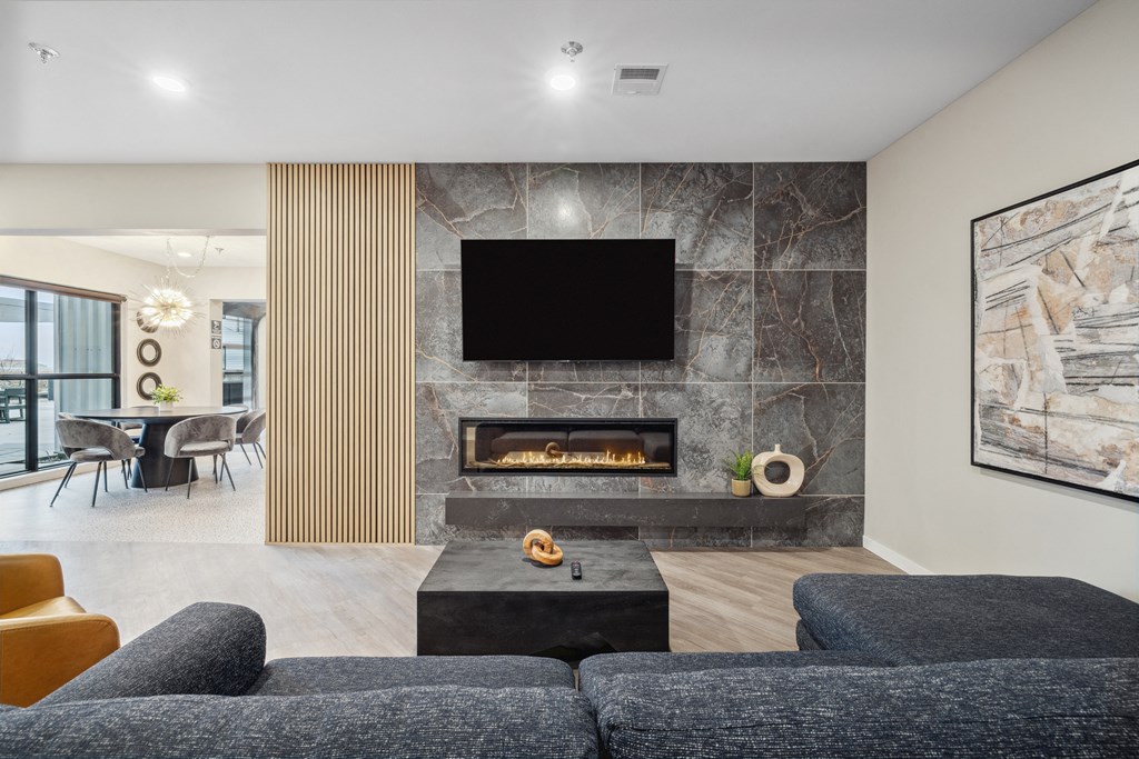 a view of a restaurant with a wall filled with different shapes and colors of wood