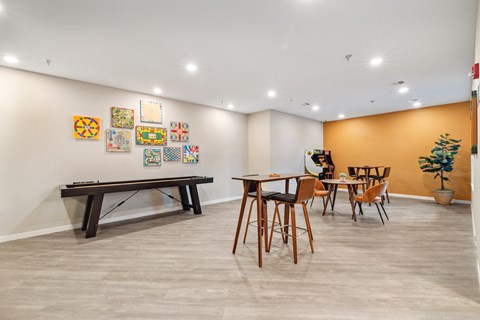 a dining room with a table and chairs and a pool table