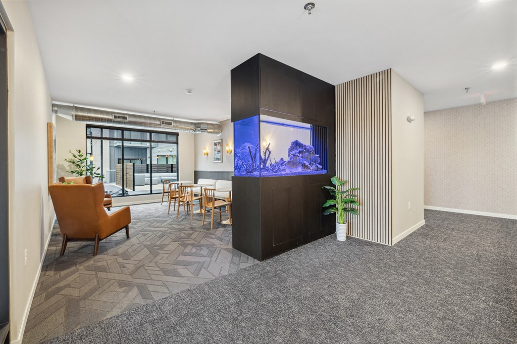 a living room with a large tv in the corner