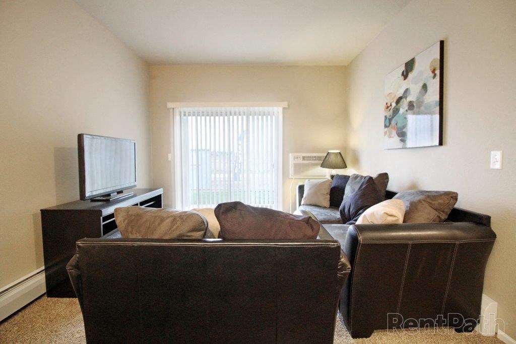 a living room with a couch and a tv