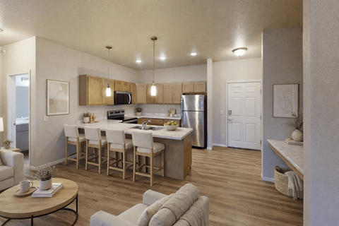 A modern kitchen with a dining table and chairs.