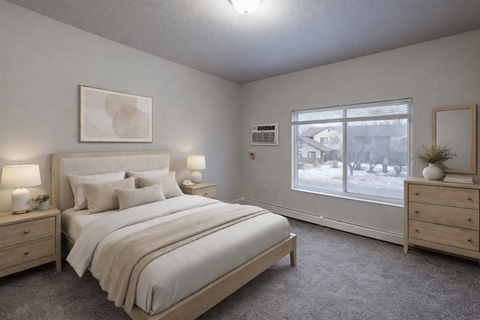 A bedroom with a large bed, two nightstands, and a window showing a snowy view outside.
