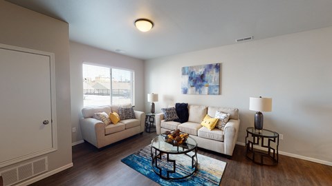 a living room with couches and a coffee table