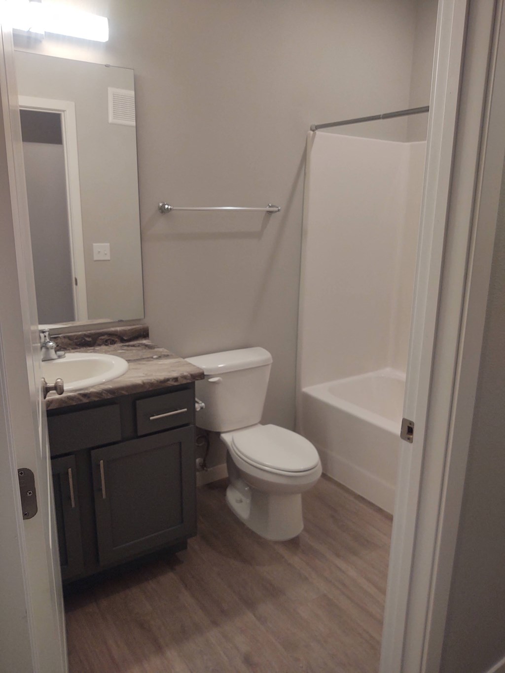a bathroom with a sink toilet and shower at Northern Lights, West Fargo, North Dakota