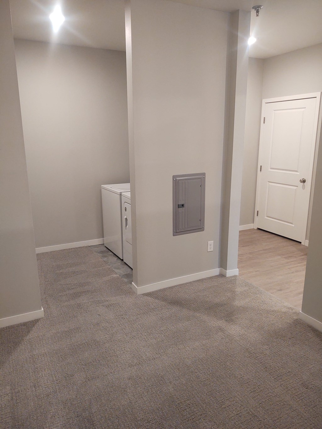 a bedroom with washer and dryer in it at Northern Lights a Lifestyle-Driven Community, North Dakota, 58078