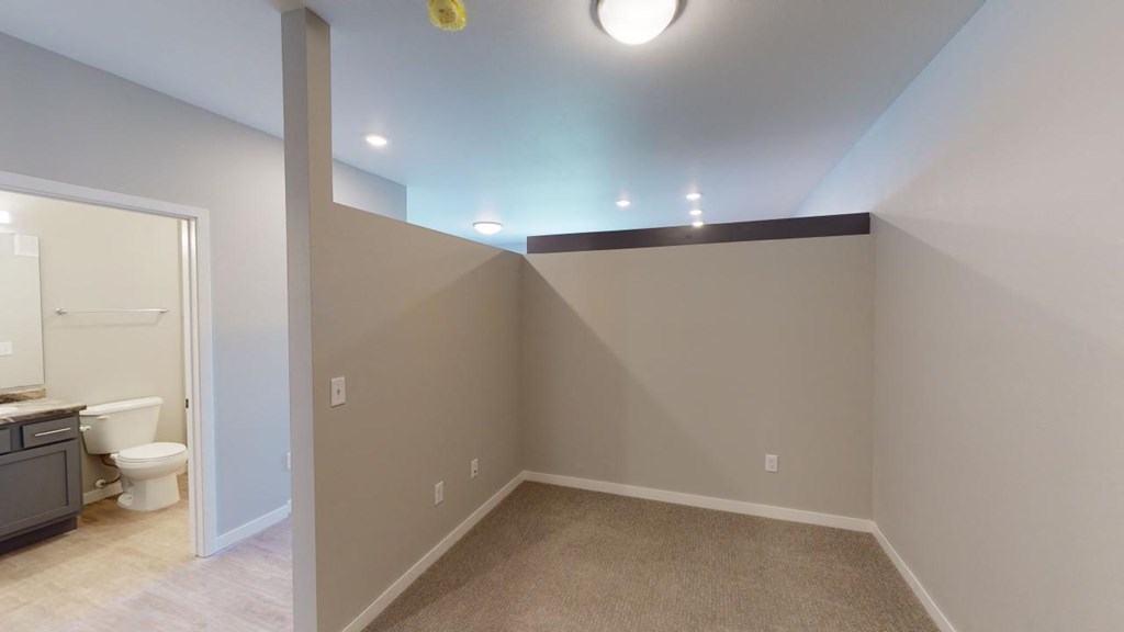 a empty room with a toilet and a sink in it at Northern Lights a Lifestyle-Driven Community, West Fargo, 58078