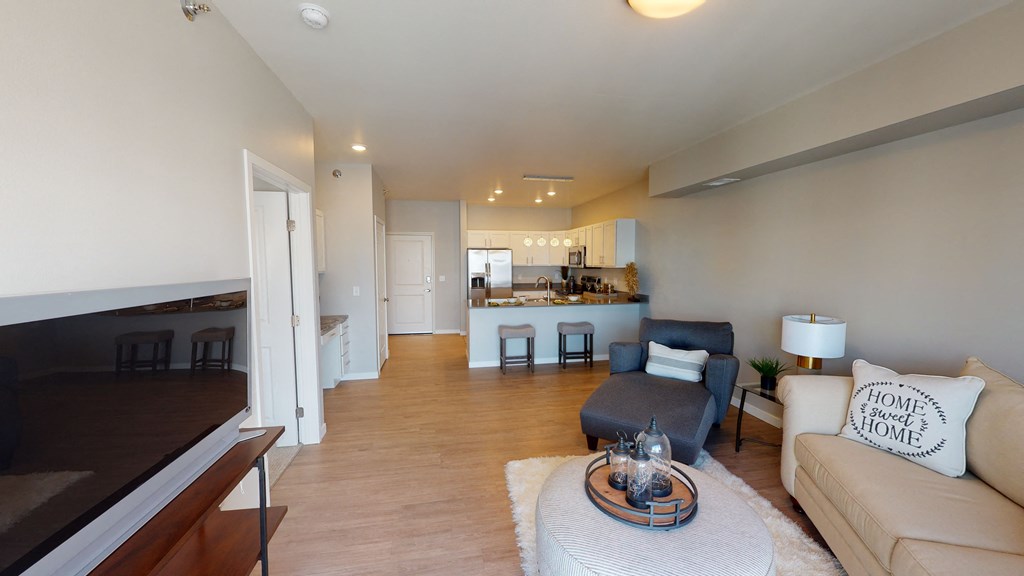 living room and kitchen at Northern Lights a Lifestyle-Driven Community, West Fargo