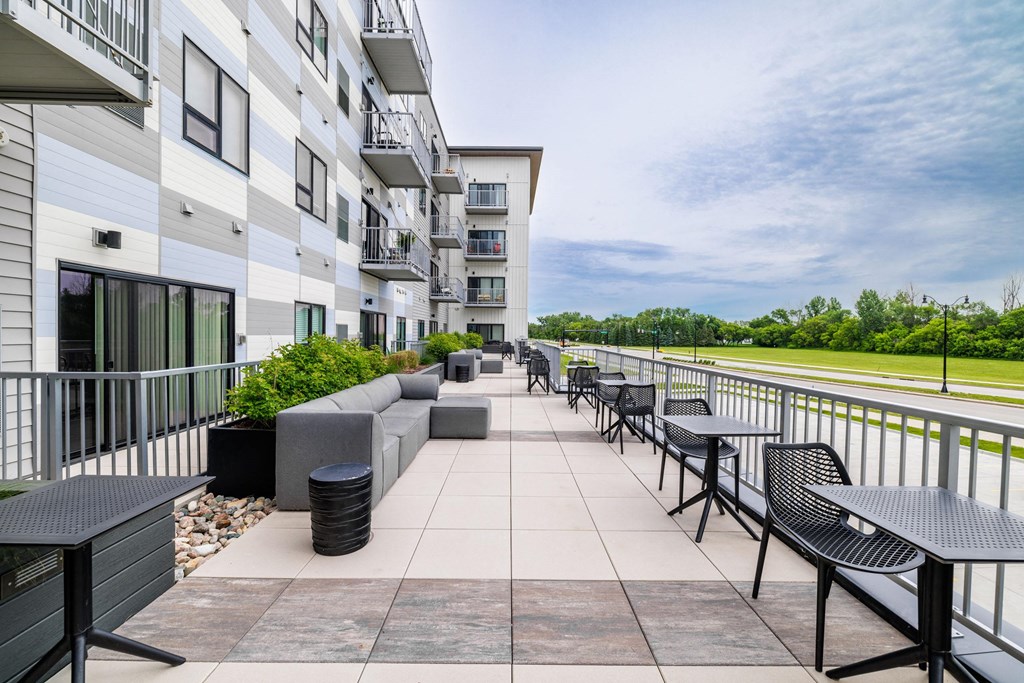the preserve at ballantyne commons community patio with tables and chairsat Northern Lights a Lifestyle-Driven Community, West Fargo, 58078