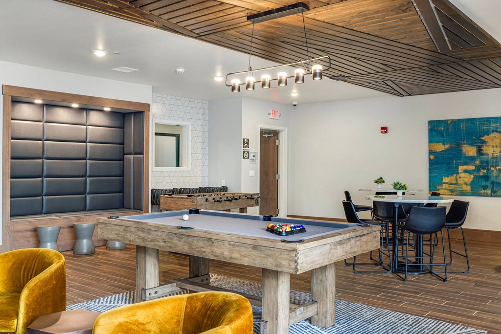 a game room with a pool table and a barat Northern Lights a Lifestyle-Driven Community, West Fargo, 58078