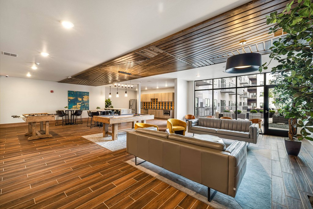 a living room with couches and tables and a large windowat Northern Lights a Lifestyle-Driven Community, West Fargo, ND, 58078