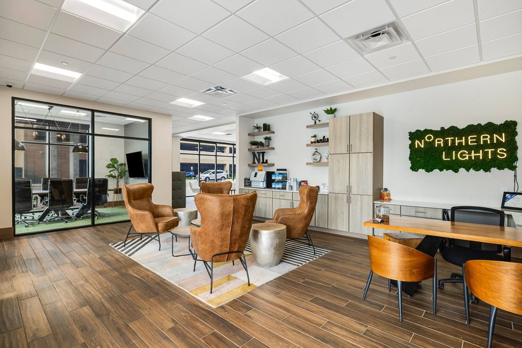 a lounge area with chairs and a table in a break room at Northern Lights a Lifestyle-Driven Community, West Fargo, ND