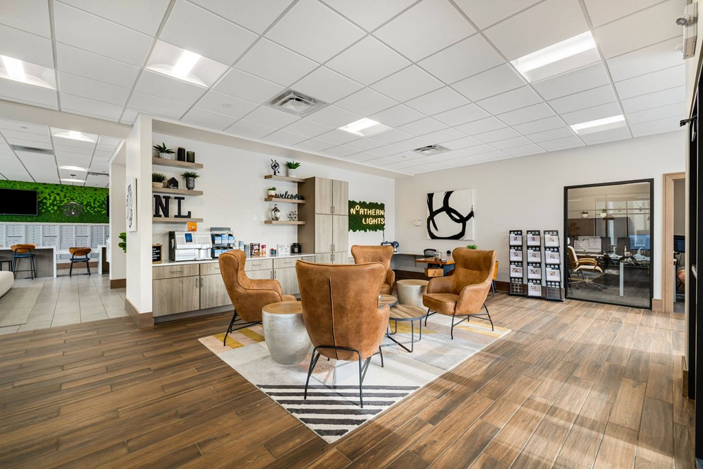 the waiting room of a salon with chairs and a table at Northern Lights a Lifestyle-Driven Community, West Fargo, ND