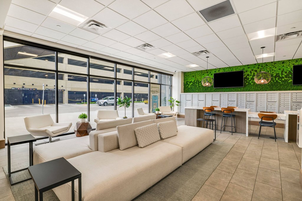 a rendering of a living room with a white couch and tables at Northern Lights a Lifestyle-Driven Community, West Fargo, North Dakota