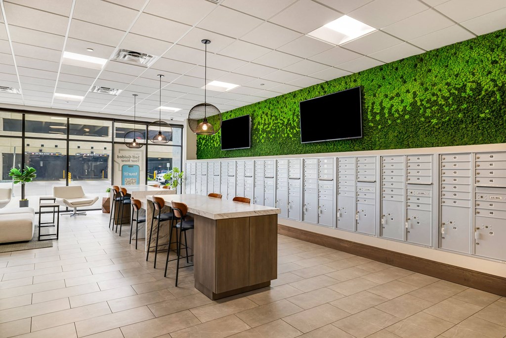 a locker room with lockers and chairs and plants on the wallat Northern Lights a Lifestyle-Driven Community, West Fargo, North Dakota