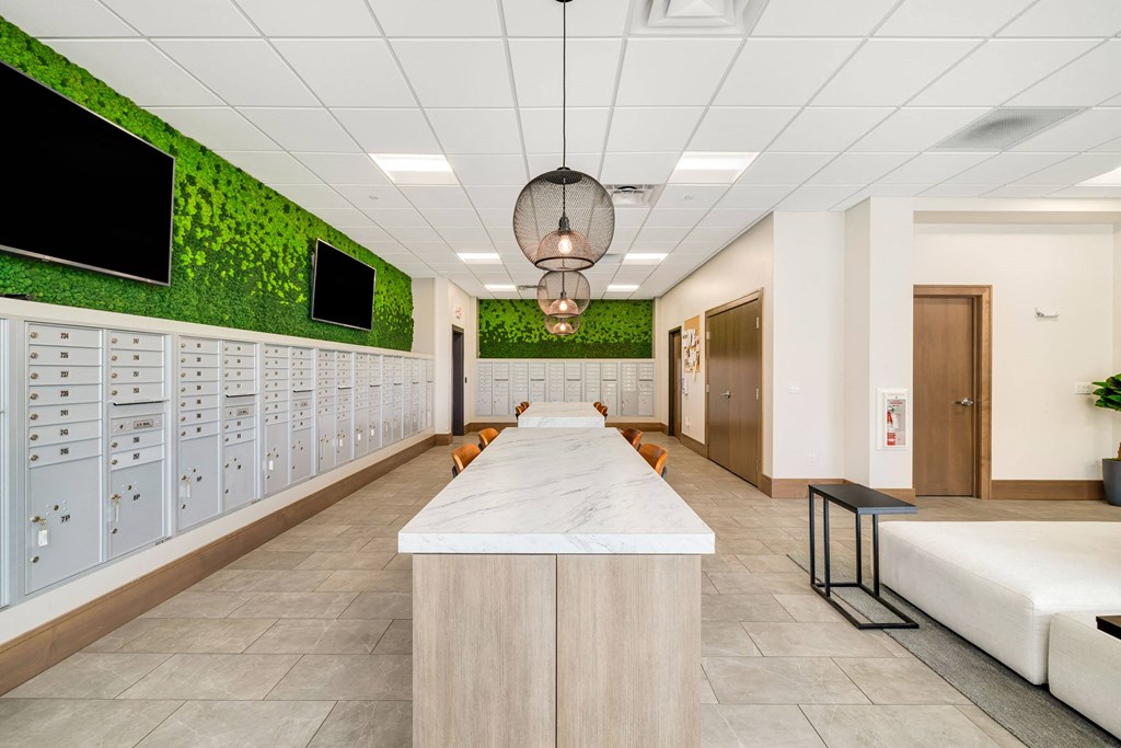 a locker room in a hospital with a long counter and a row of lockers at Northern Lights a Lifestyle-Driven Community, West Fargo, 58078