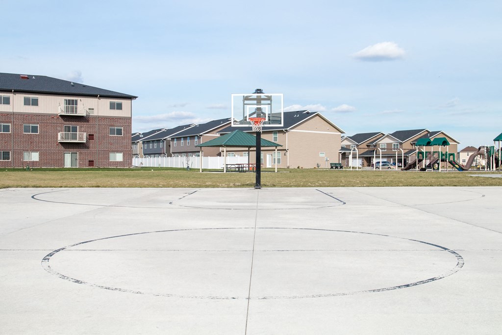 A basketball court with a hoop in the middle of it.