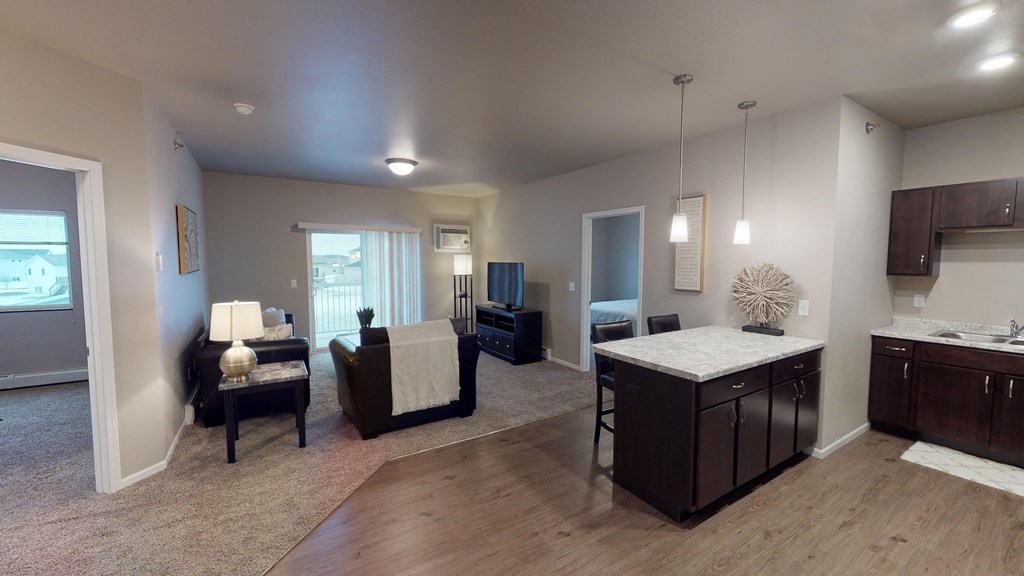 A well-lit living room with a couch, chair, and a coffee table.