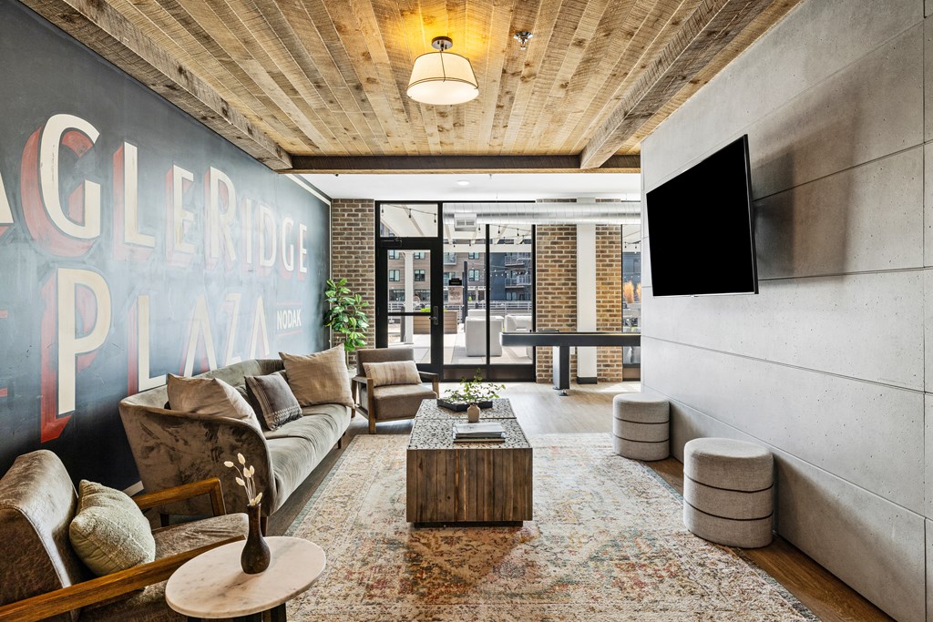 a living room with a couch and a coffee table and a tv at EagleRidge Plaza Residences, Fargo, ND
