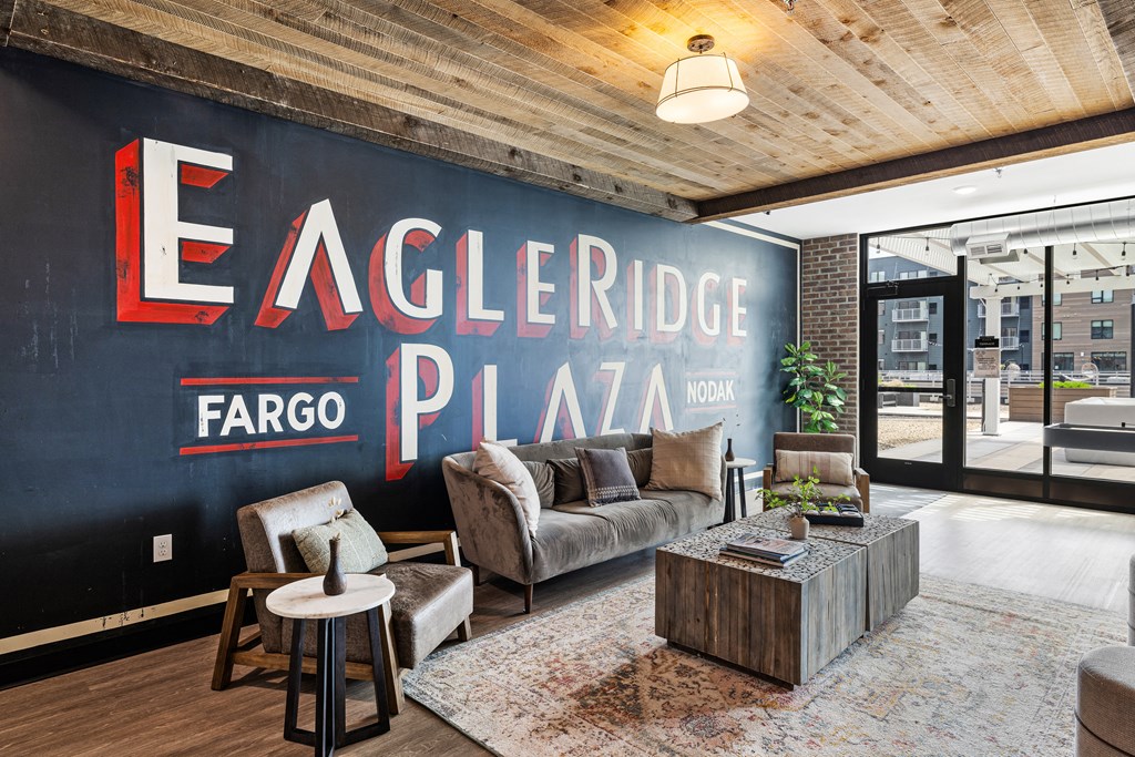 a living room with a large mural on the wall at EagleRidge Plaza Residences, Fargo, ND