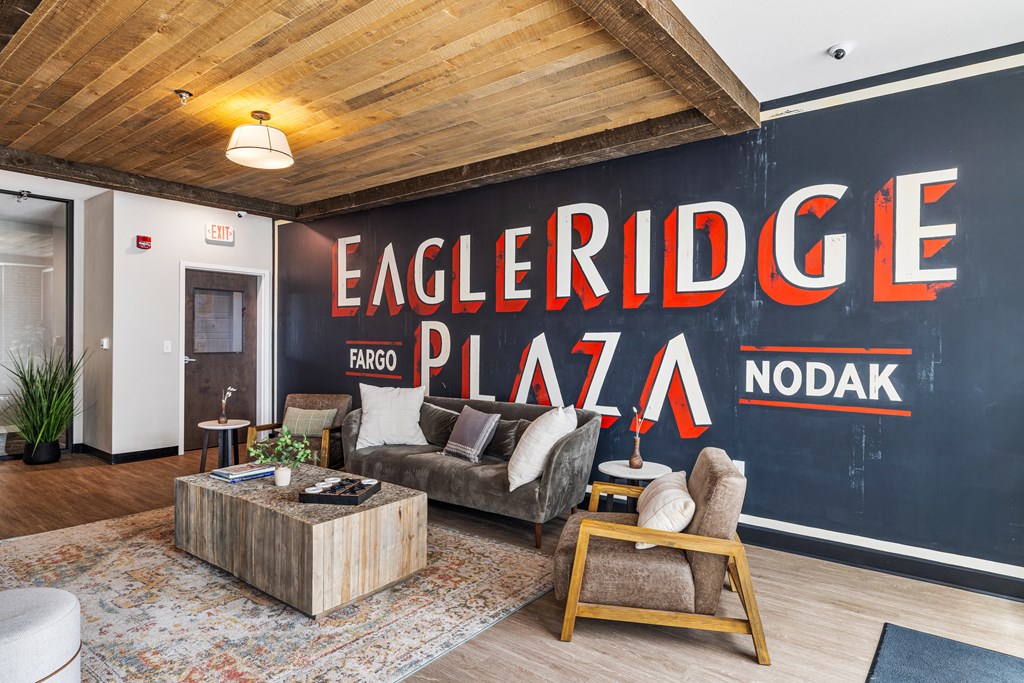 a living room with a large mural on the wall at EagleRidge Plaza Residences, Fargo, ND