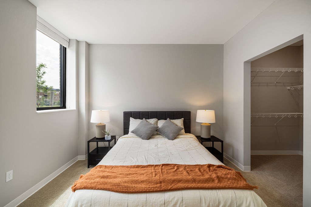 a bedroom with a large bed and a closet at EagleRidge Plaza Residences, Fargo, ND, 58104