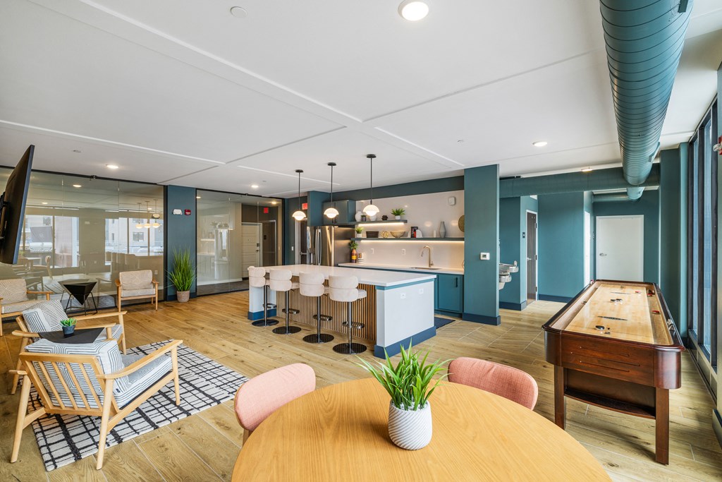 a living room with a table and chairs and a kitchen at EagleRidge Plaza Residences, Fargo, ND, 58104