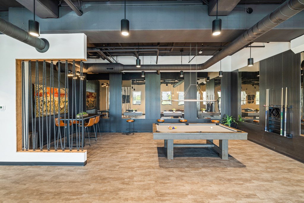 a game room with a pool table and tables at EagleRidge Plaza Residences, North Dakota, 58104