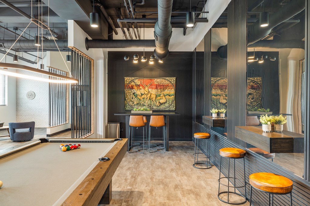 a game room with a pool table and a bar at EagleRidge Plaza Residences, North Dakota