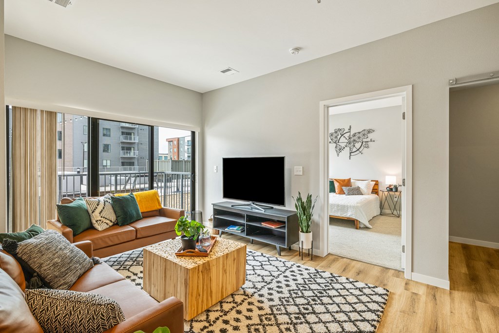 a living room with a couch and a tv at EagleRidge Plaza Residences, Fargo, ND