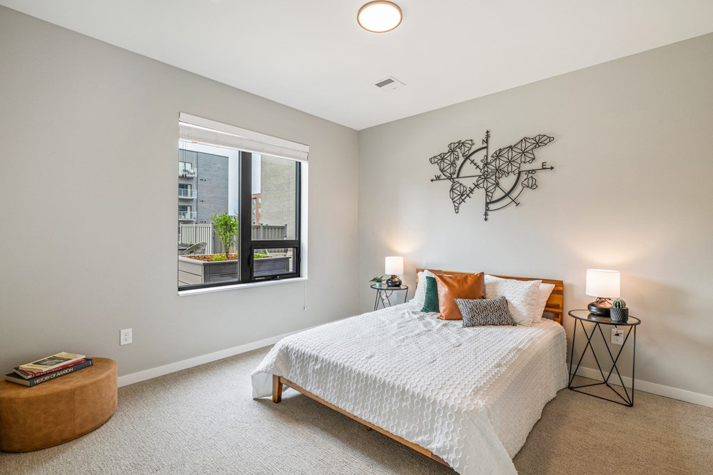 a bedroom with a bed and a large window at EagleRidge Plaza Residences, Fargo, 58104