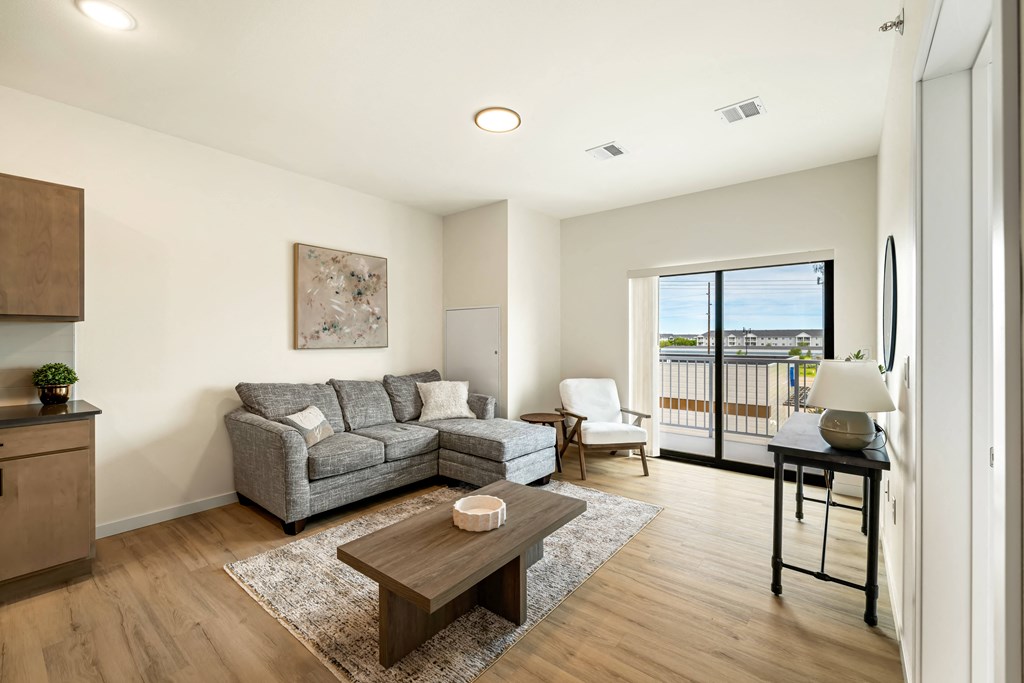 a living room with a couch and a coffee table at The Standard on 32nd, North Dakota