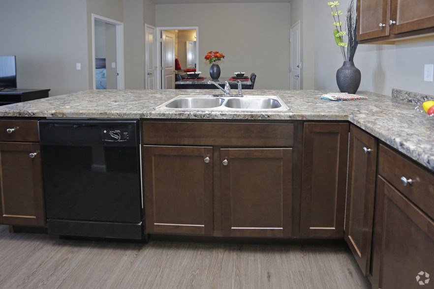 a kitchen with a granite counter top and a sink