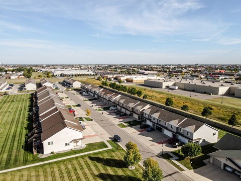 A suburban neighborhood with houses and apartment buildings.