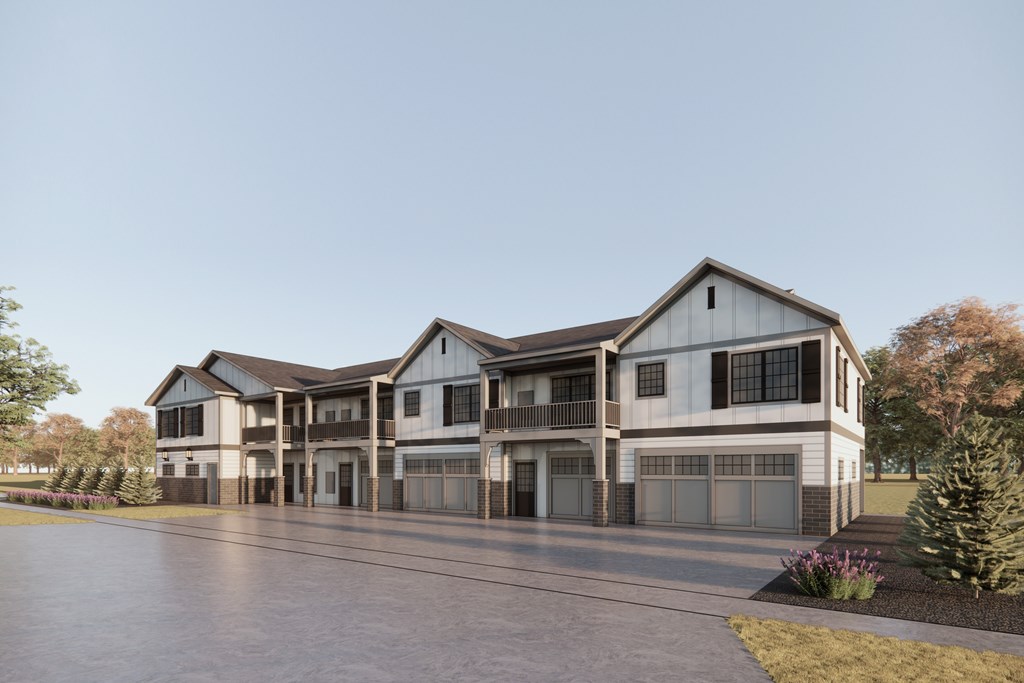 A modern two-story house with a large garage.