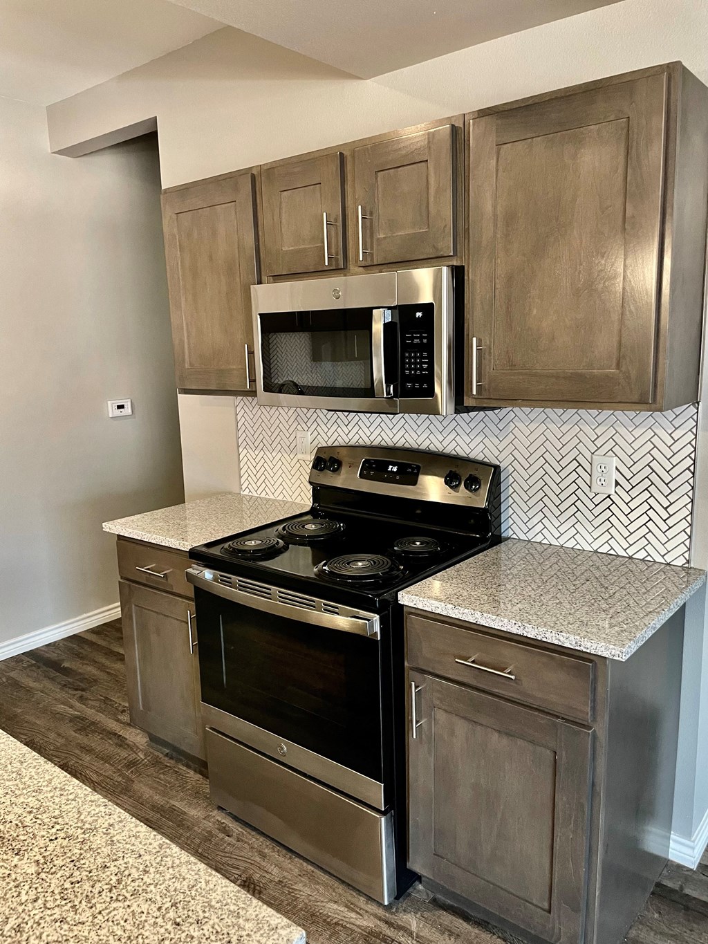 a kitchen with stainless steel appliances and a counter top