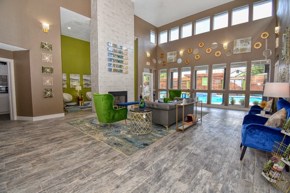 a living room with couches and chairs and a fireplace