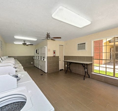 a kitchen with a stove and a table