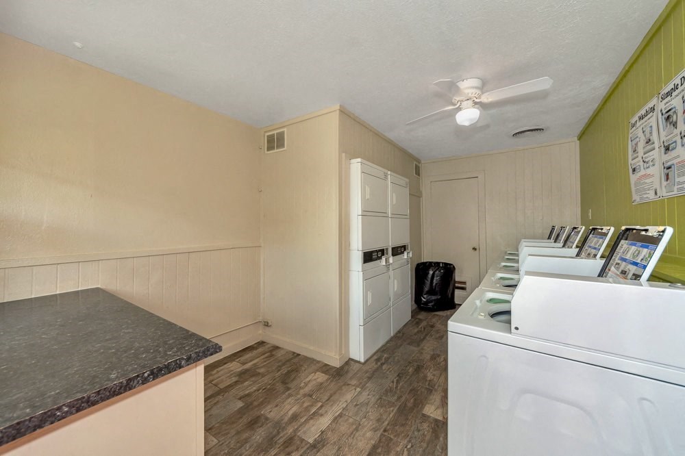 a kitchen with a counter top and a white stove