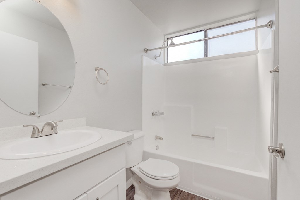 a bathroom with a sink toilet and a shower