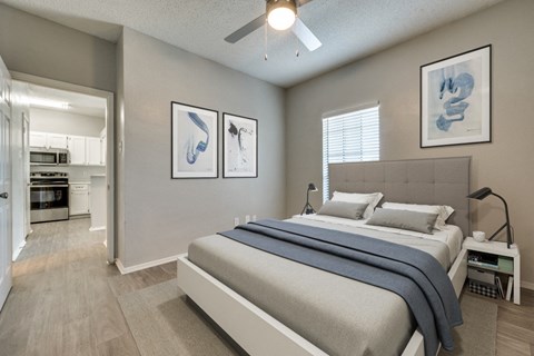a bedroom with a bed and a ceiling fan at Foxborough Apartments, Irving, TX, Texas, 75061