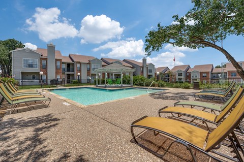 the preserve at ballantyne commons pool with lounge chairs and apartment buildings