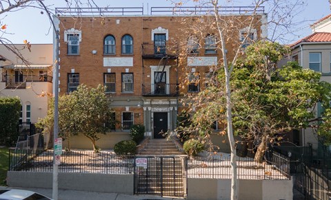 A building with a black gate in front of it at Kenmore Park Apartments, Los Angeles, CA