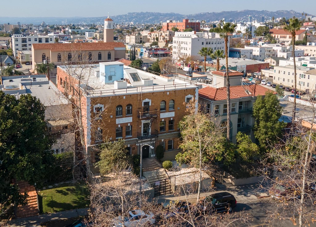A cityscape with a prominent building in the foreground at Kenmore Park Apartments, Los Angeles, California