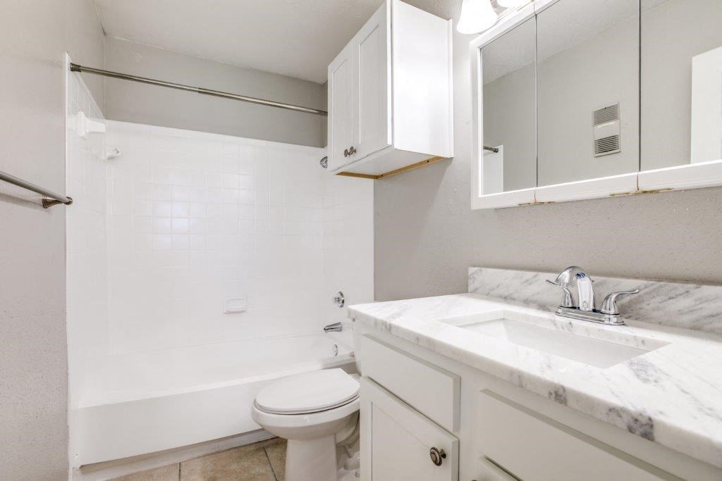 Bathroom With Bathtub at Seacrest Apartments, Garland, Texas