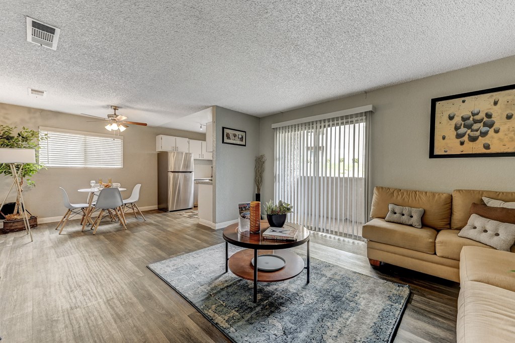 a living room with a couch and a table and a kitchen at Desert Bay Apartments, Laughlin,89029