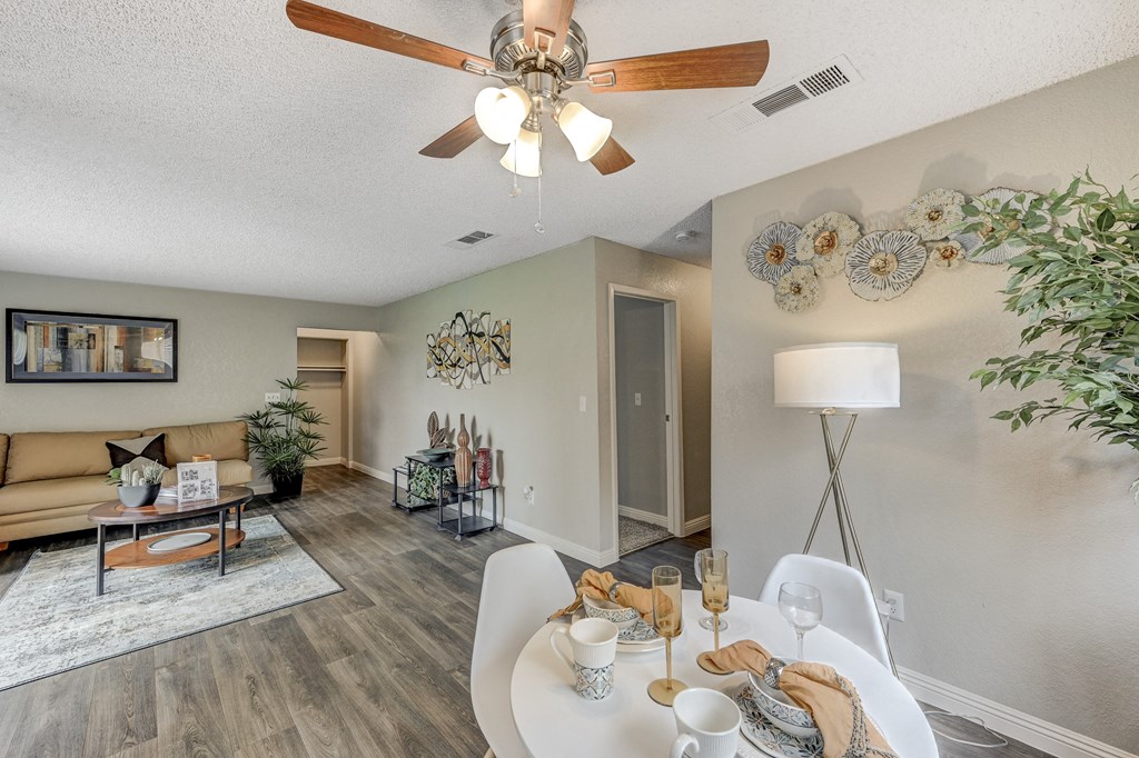 our living room and dining room are spacious and modern with a ceiling fan at Desert Bay Apartments, Laughlin,89029